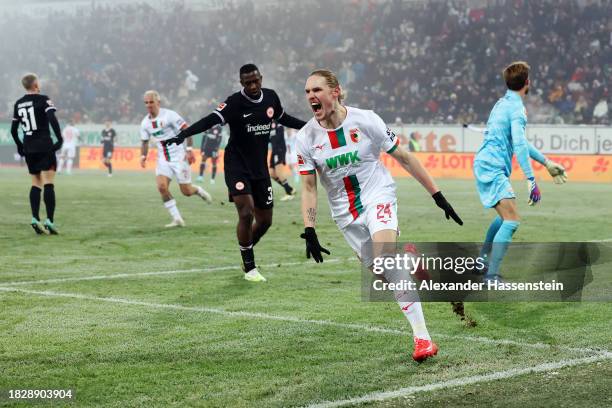 Fredrik Jensen of FC Augsburg celebrates after scoring the team's first goal during the Bundesliga match between FC Augsburg and Eintracht Frankfurt...