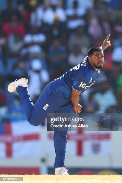 Rehan Ahmed of England bowls during the 1st CG United One Day International match between West Indies and England at Sir Vivian Richards Stadium on...