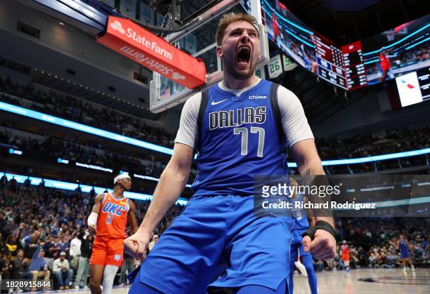 Luka Doncic of the Dallas Mavericks reacts after scoring against the Oklahoma City Thunder in the fouth quarter at American Airlines Center on...