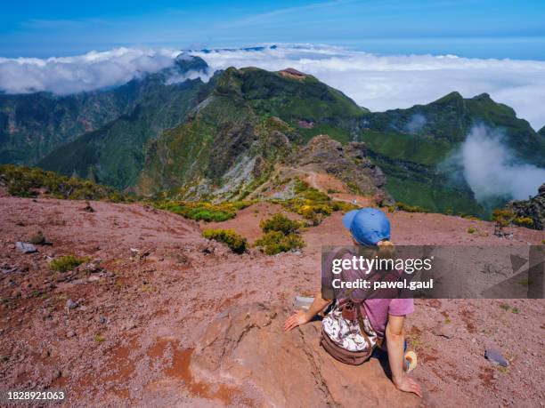 hiker on pr1 pico do arieiro - pico ruivo trail madeira portugal - pico ruivo stock pictures, royalty-free photos & images