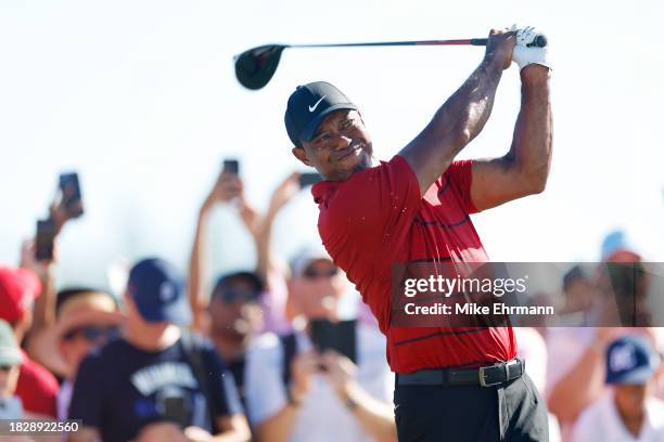 Tiger Woods of the United States plays his shot from the 15th tee during the final round of the Hero World Challenge at Albany Golf Course on...