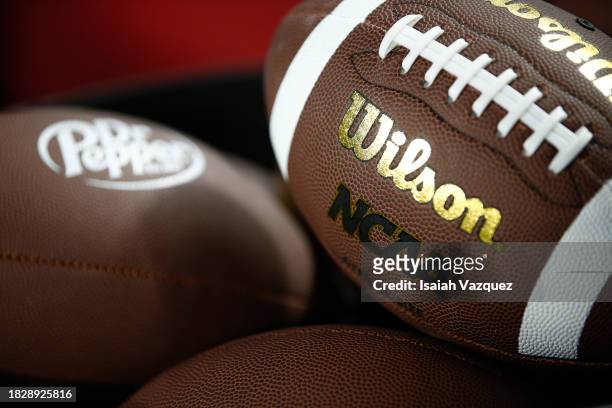 The Wilson and NCAA Logo is shown on a football as the Louisville Cardinals take on the Florida State Seminoles during the ACC Championship at Bank...