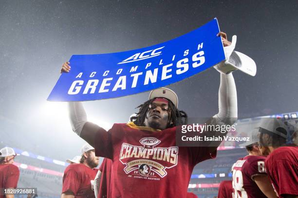 The Florida State Seminoles celebrate after the trophy ceremony after defeating the Louisville Cardinals during the ACC Championship at Bank of...