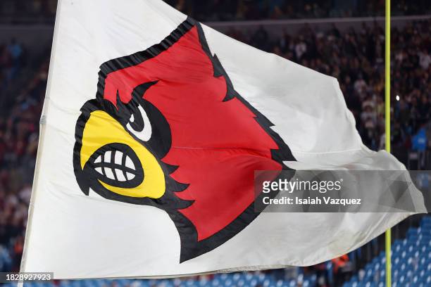The Louisville Cardinals logo is shown on a flag before the Florida State Seminoles take on the Louisville Cardinals during the ACC Championship at...