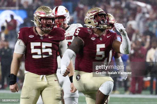 Jared Verse of the Florida State Seminoles reacts with Braden Fiske of the Florida State Seminoles after a sack against the Louisville Cardinals...