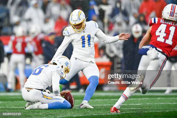 Cameron Dicker of the Los Angeles Chargers kicks a field goal as JK Scott holds in the second quarter against the New England Patriots at Gillette...