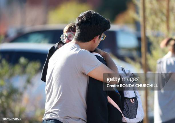 Student Amanda Perez is comforted by fiance Alejandro Barron following a shooting at the University of Nevada, Las Vegas, campus in Las Vegas on...