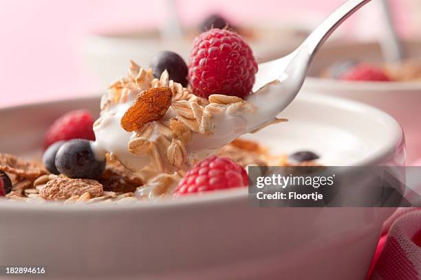 breakfast stills: cereals with raspberries and blueberries - granola stock pictures, royalty-free photos & images