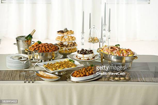 long table with holiday buffet served - food and drink industry stock pictures, royalty-free photos & images
