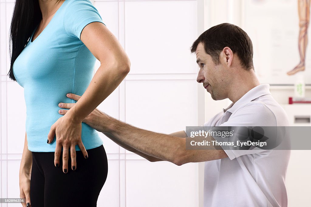 Physical Therapist Examming a Patient