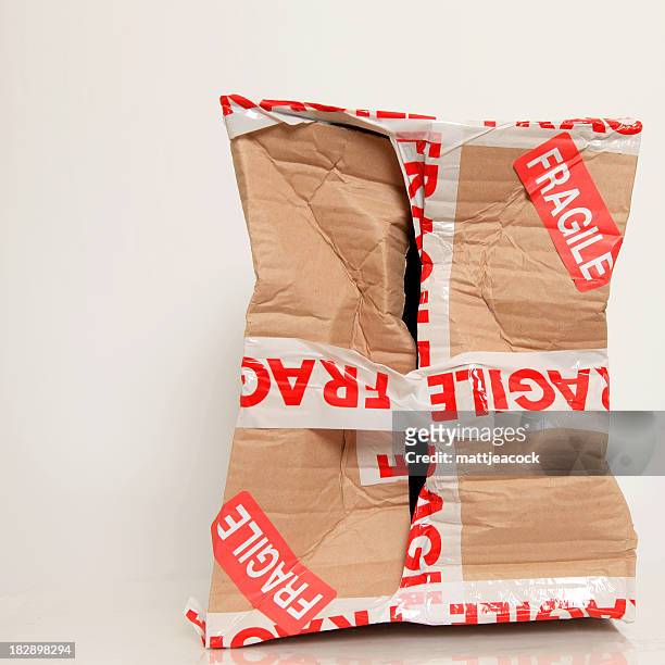 damaged fragile parcel - damaged parcel stock pictures, royalty-free photos & images
