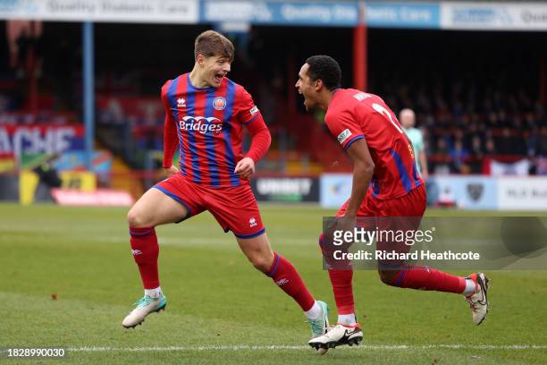 Josh Stokes of Aldershot Town celebrates with teammate Haji Mnoga after scoring the team's first goal during the Emirates FA Cup Second Round match...