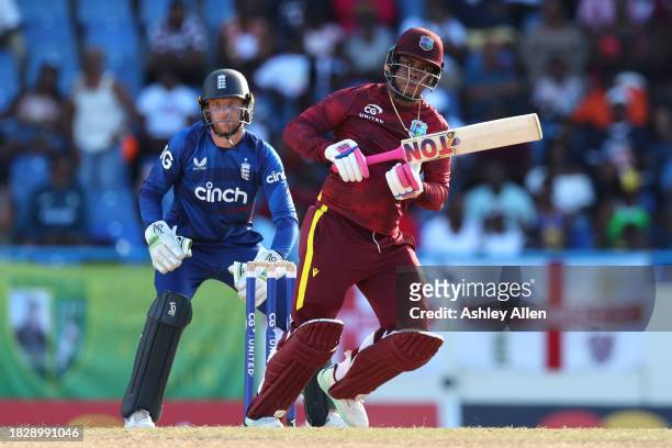 Shimron Hetmyer of West Indies bats as Jos Buttler of England keeps wicket during the 1st CG United One Day International match between West Indies...