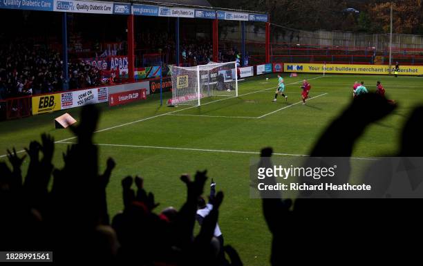 Josh Stokes of Aldershot Town celebrates after scoring the team's secondgoal during the Emirates FA Cup Second Round match between Aldershot Town and...