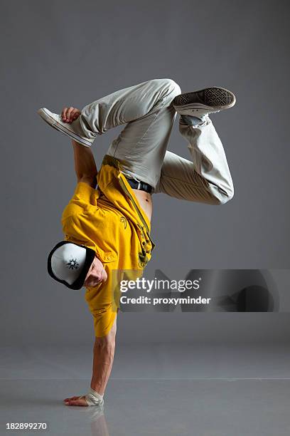 break dancer stand on one arm - hip hop culture stock pictures, royalty-free photos & images