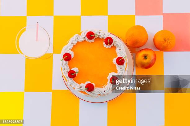 flat lay of orange birthday cake - paper decoration stock pictures, royalty-free photos & images