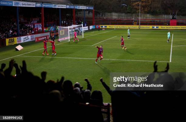 Josh Stokes of Aldershot Town celebrates after scoring the team's second goal during the Emirates FA Cup Second Round match between Aldershot Town...