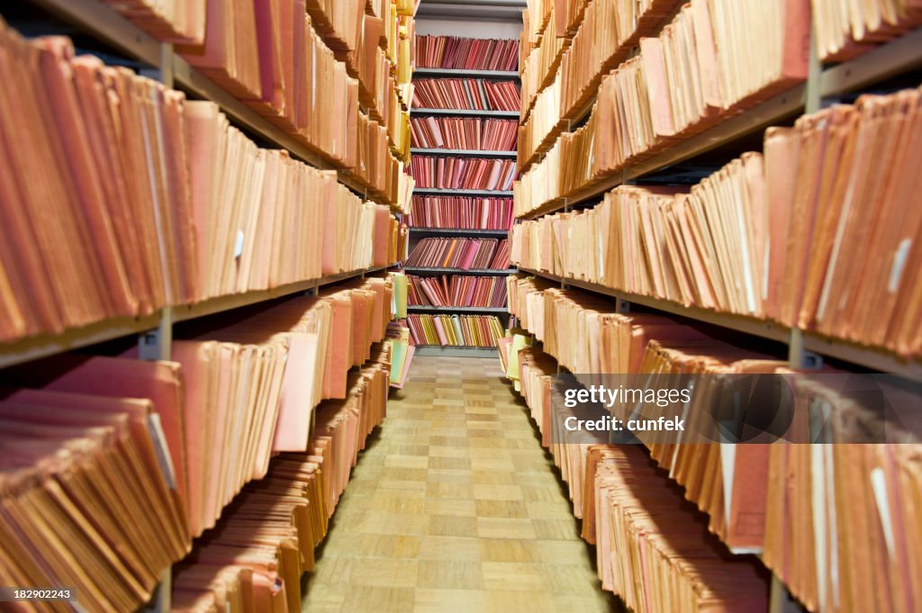 Old files stacked on library shelves