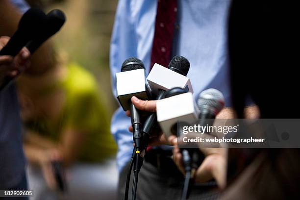 interview - microphone press conference stock pictures, royalty-free photos & images