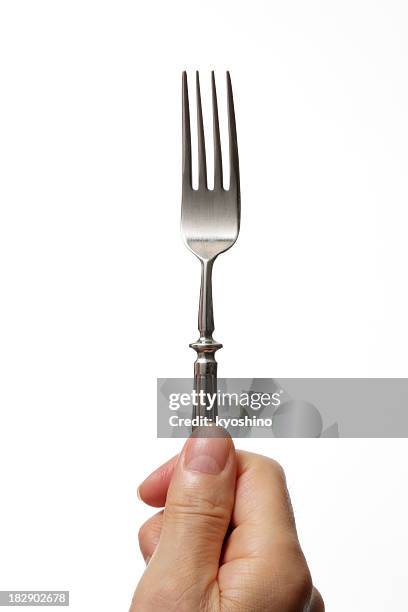 aislado fotografía de sujeción de horquilla y contra un fondo blanco. - tenedor fotografías e imágenes de stock