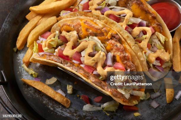 the viral smash ground chicken cheese burger taco - turkey burger stock pictures, royalty-free photos & images