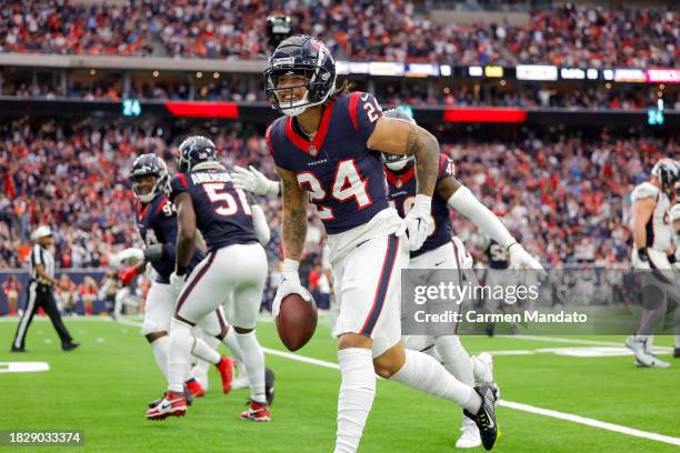 Derek Stingley Jr. #24 of the Houston Texans celebrates after making an interception in the third quarter against the Denver Broncos at NRG Stadium...