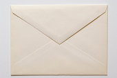 Isolated shot of closed an old envelope on white background