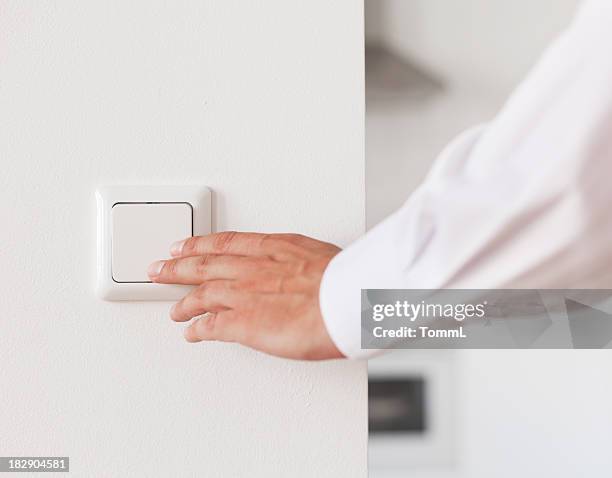 turning light on / off - light switch stock pictures, royalty-free photos & images
