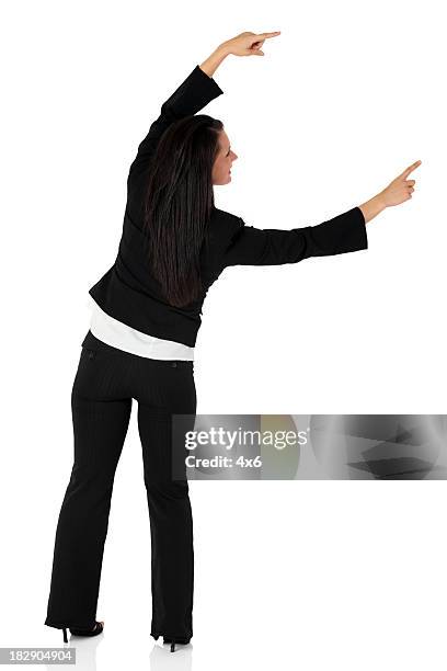 businesswoman pointing against white background - presenter isolated stock pictures, royalty-free photos & images