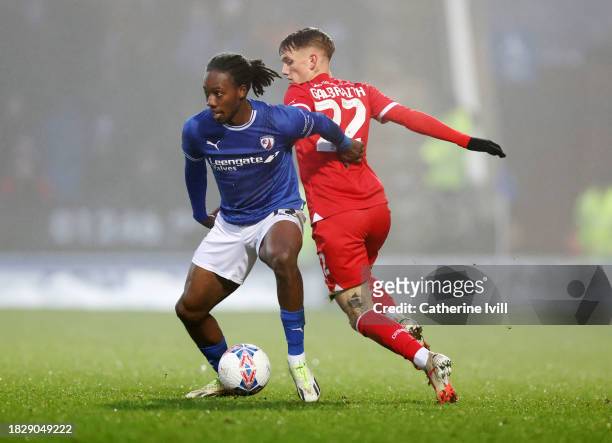 Ryheem Sheckleford of Chesterfield battles for possession with Ethan Galbraith during the Emirates FA Cup Second Round match between Chesterfield and...