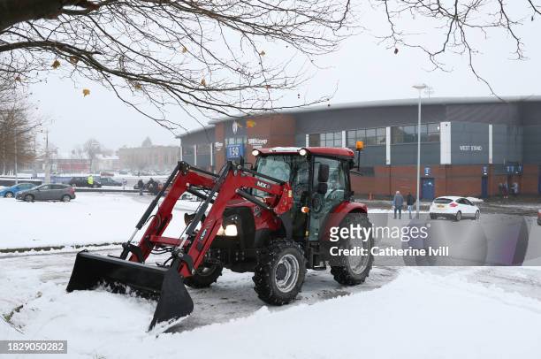 Snow plough clears the snow from the car park outside the stadium ahead of the Emirates FA Cup Second Round match between Chesterfield and Leyton...