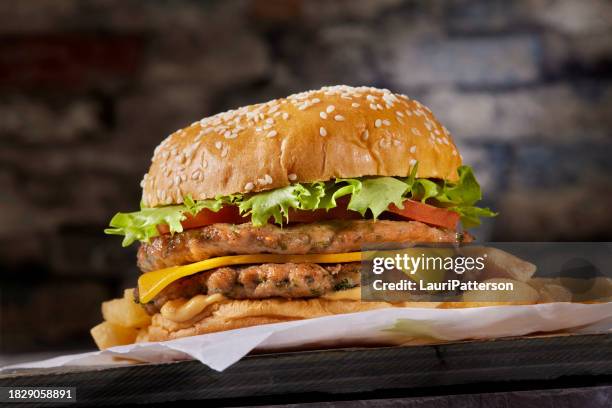 the viral smash ground chicken cheese burger taco - turkey burger stock pictures, royalty-free photos & images