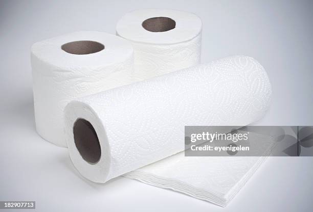 rolls of toilet paper, paper towels and napkins in white - kitchen paper stockfoto's en -beelden