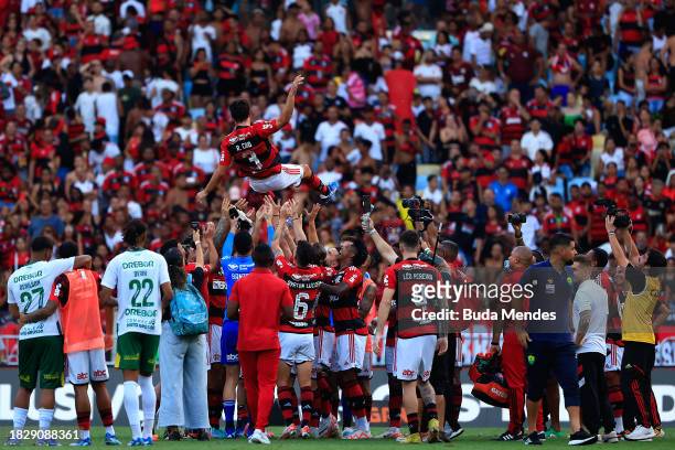 Rodrigo Caio of Flamengo honors by his teammates after winning the match between Flamengo and Cuiaba as part of Brasileirao 2023 at Maracana Stadium...