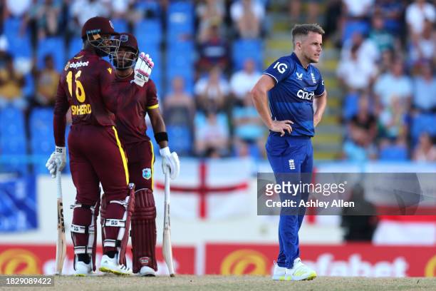 Sam Curran of England reacts to a boundary being hit off his bowling during the 1st CG United One Day International match between West Indies and...