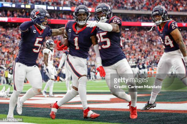 Jimmie Ward of the Houston Texans celebrates with teammates after making an interception in the fourth quarter against the Denver Broncos at NRG...