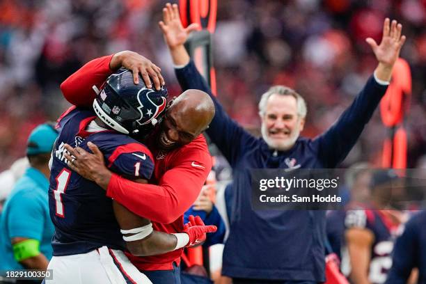 Jimmie Ward and head coach DeMeco Ryans of the Houston Texans celebrate after Ward made an interception in the fourth quarter against the Denver...