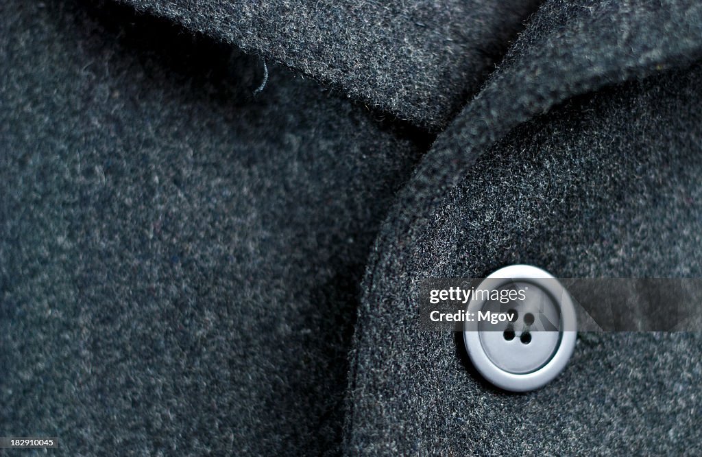 Dark wool coat with one black button