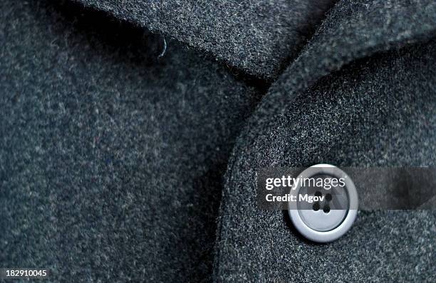 dark wool coat with one black button - clothes buttons stock pictures, royalty-free photos & images