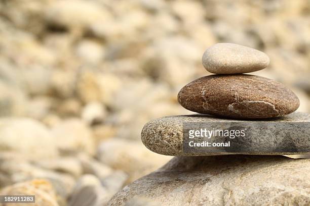 stones in balance - energy healing stock pictures, royalty-free photos & images