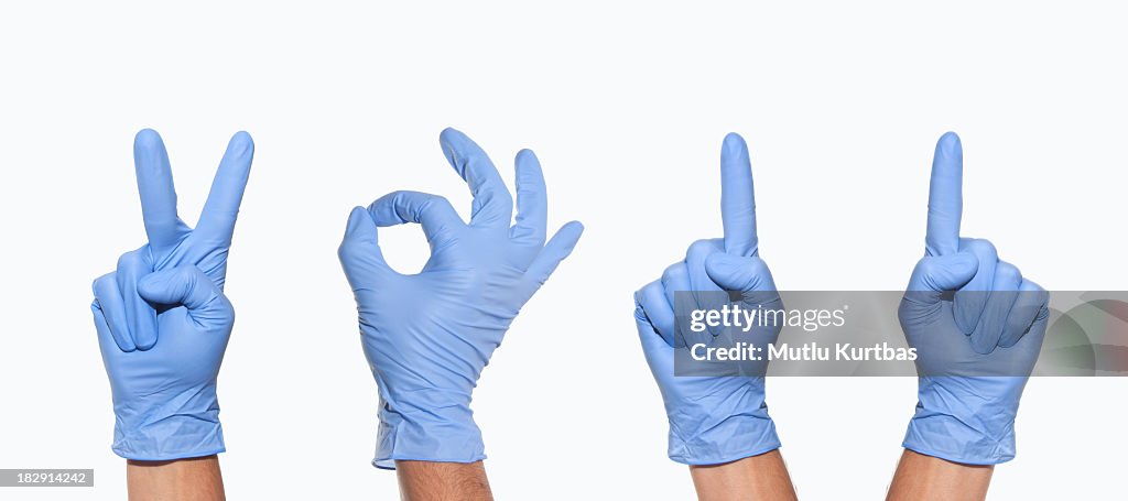 2011 from blue gloved hands on white background