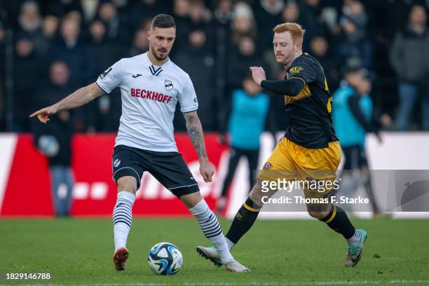 Maximilian Wolfram of Verl and Paul Will of Dresden fight for the ball during the 3. Liga match between SC Verl and Dynamo Dresden at SPORTCLUB Arena...