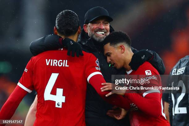 Liverpool manager Jurgen Klopp celebrates with Virgil van Djik and Trent Alexander-Arnold at full-time following the Premier League match between...