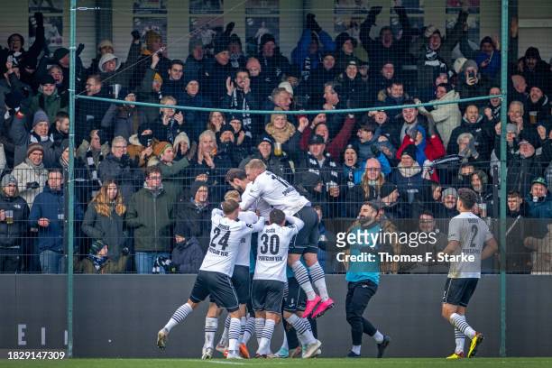 Players of Verl celebrate their teams first goal during the 3. Liga match between SC Verl and Dynamo Dresden at SPORTCLUB Arena on December 03, 2023...