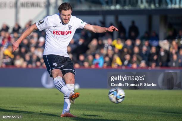 Marcel Benger of Verl kicks the ball during the 3. Liga match between SC Verl and Dynamo Dresden at SPORTCLUB Arena on December 03, 2023 in Verl,...