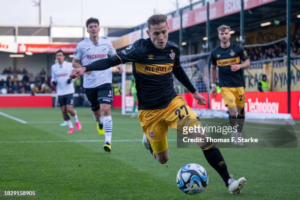 Niklas Hauptmann of Dresden runs with the ball during the 3. Liga match between SC Verl and Dynamo Dresden at SPORTCLUB Arena on December 03, 2023 in...