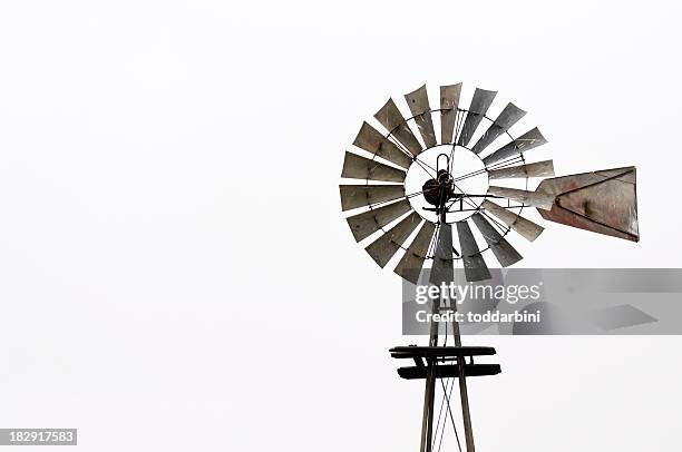 antiguo molino de viento aislado - molino de viento tradicional fotografías e imágenes de stock