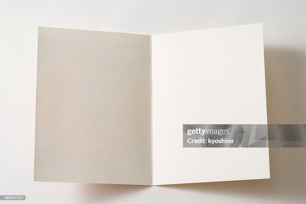 Isolated shot of opened antique blank paper on white background