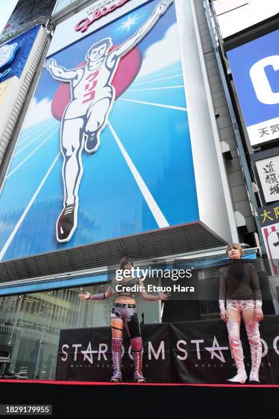 And Saori Anou are seen in front of the Glico billboard during the Women's Pro-Wrestling "Stardom" Press Conference on November 16, 2023 in Osaka,...