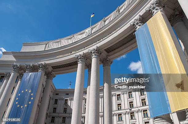 ukrainian and eu flag on kiev ministry of foreign affairs - customs union stock pictures, royalty-free photos & images